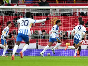 Georginio Rutter, centre, celebrates scoring Brighton's third goal against Manchester United