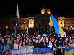 People gather in Trafalgar Square, central London waving Ukraine flags