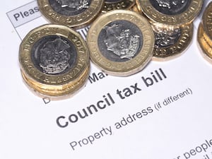 A council tax bill and some pound coins