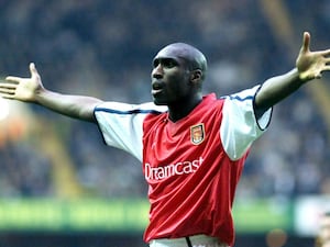 Arsenal defender Sol Campbell with arms stretched out wide