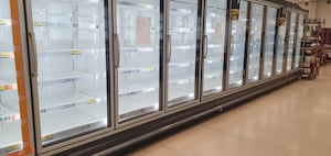 Empty freezer cabinets at Tesco Superstore, Penn Road