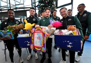  Walsall FC players meet staff and patients at Walsall Manor Hospital at the town's Manor Hospital as they give presents out.
Liam Gordon, Connor Barrett, Jamie Jellis and Charlie Lakin have their hands full