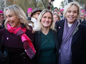 Kim Leadbeater (centre) with cancer patient Sophie Blake (left) and Esther Rantzen's daughter, Rebecca Wilcox after hearing the result of the vote in parliament for her Terminally Ill Adults (End of Life) Bill in Westminster in November 2024