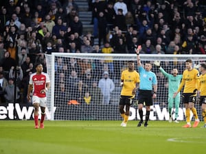 Arsenal’s Myles Lewis-Skelly is shown a red card by referee Michael Oliver