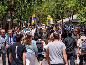 Crowds of people on a street in Madrid, Spain