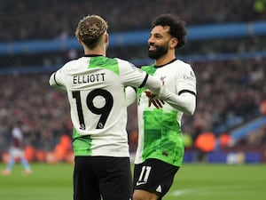 Liverpool’s Harvey Elliott and Mohamed Salah celebrate