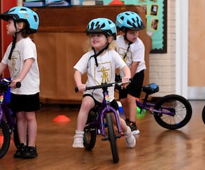 Reception pupils learning to ride bikes