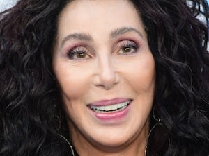 Cher smiles at the camera