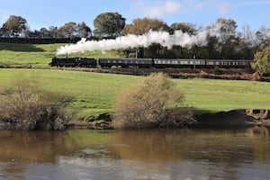 BR Standard 75069 passes the river Severn near Arley.  