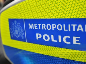 Metropolitan Police badge on vehicle