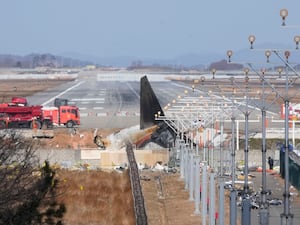 The wreckage of a Boeing 737-800 plane operated by South Korean budget airline Jeju Air lies at Muan International Airport