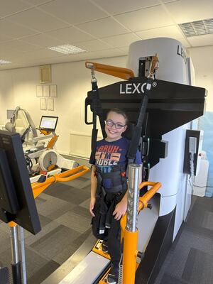 A young patient at Complete Neuro Rehab benefits from the innovative robotic treatment.