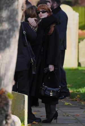 Girls Aloud singer Nicola Roberts seen hugging mourner 