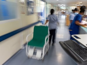 Blurred image of staff on a NHS hospital ward