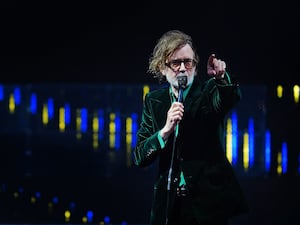 Jarvis Cocker of Pulp performing on stage