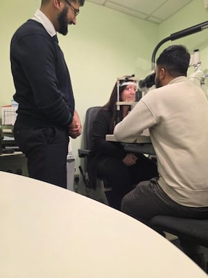 Opticians in Specsavers performing a sight test 