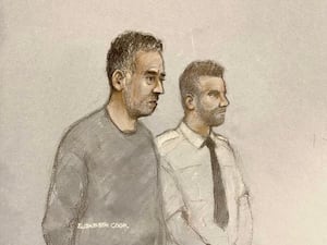 Court sketch of Paul Butler, next to a security officer