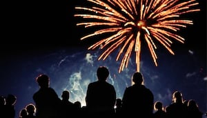 Families enjoy a Bonfire Night fireworks display