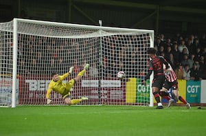 Walsall striker Ellis Harrison opens the scoring inside the first 60 seconds.