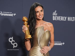 Demi Moore with her Golden Globe award