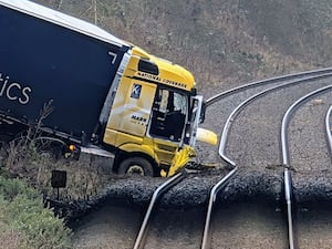 A lorry after crashing onto a railway line