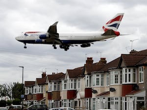 A British Airways plane over West London on the approach to Heathrow Airport