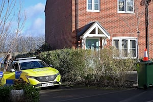 A man has been arrested on suspicion of murder after a woman was found in a critical condition in Devereux Gardens