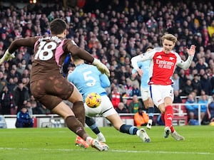 Martin Odegaard scores against Manchester City