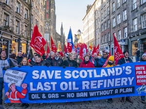 Members of the Unite union march and rally at the Scottish Parliament in protest at Petroineos plans to close Grangemouth oil refinery