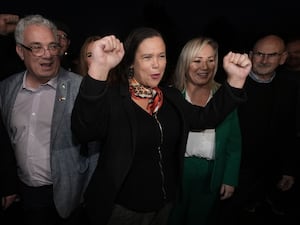 Mary Lou McDonald and Michelle O'Neill react happily towards supporters in Dublin