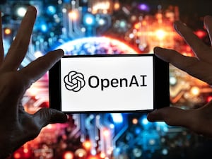 The OpenAI logo is displayed on a mobile phone