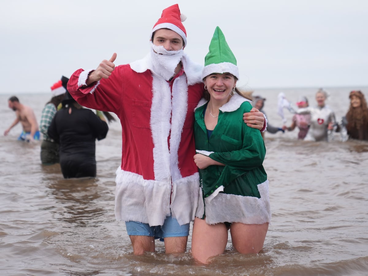 Christmas Day swimmers brave cool sea temperatures for festive dip