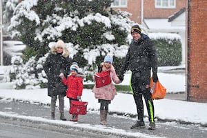 Katie and Steven with youngsters Zachary and Eliza braved the snow for the school run in Perton, near Wolverhampton