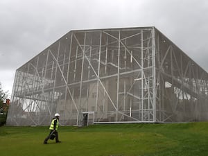 The Hill House pictured inside its protective metal box