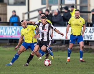 Captain Michael McGrath keeps possession. Pic: Jim Wall