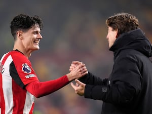 Brentford's Christian Norgaard shakes hands with manager Thomas Frank