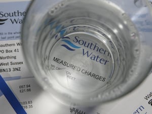 A Southern Water bill seen through the bottom of a glass