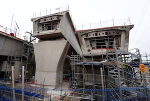 Partially built portions of the structure can be seen around the site