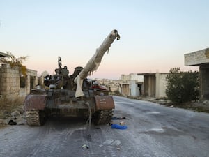 A Syrian army armoured vehicle abandoned in the village of Hass, south-west of Aleppo