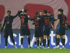 Barcelona players celebrate after taking a first-half lead in their Champions League game against Red Star Belgrade