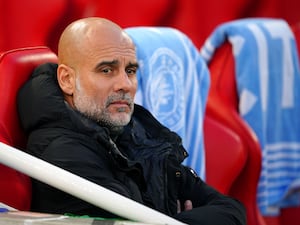 Manchester City manager Pep Guardiola in the Anfield dugout