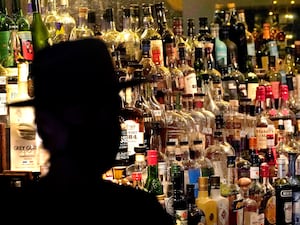 Bottles of alcohol on shelves at a bar in Houston