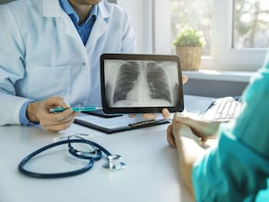 Doctor and patient discuss chest x-ray results