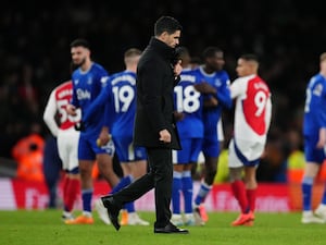 Mikel Arteta walks towards the tunnel