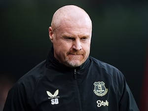 Sean Dyche looks down while wearing Everton gear