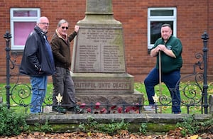 Phil Farmer, Dr Michael Hardacre and Terry Cole work to keep the area around the memorial clean and tidy