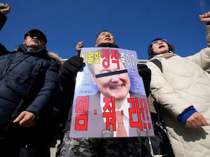 Members of main opposition Democratic Party shout slogans during a rally against South Korean President Yoon Suk Yeol at the National Assembly in Seoul,