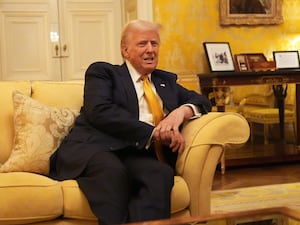 Donald Trump sitting on a settee