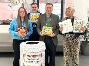 Head of Student Services, Jamie Morgan-Green alongside level 3 Childcare and Early Years Students Annieka, Sheldon and Ezmee