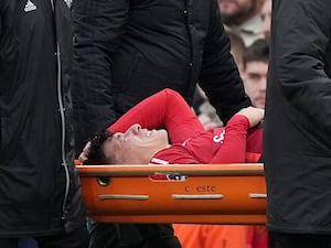 Manchester United’s Lisandro Martinez leaves the pitch on a stretcher after going down injured during the match against Crystal Palace (Martin Rickett/PA)